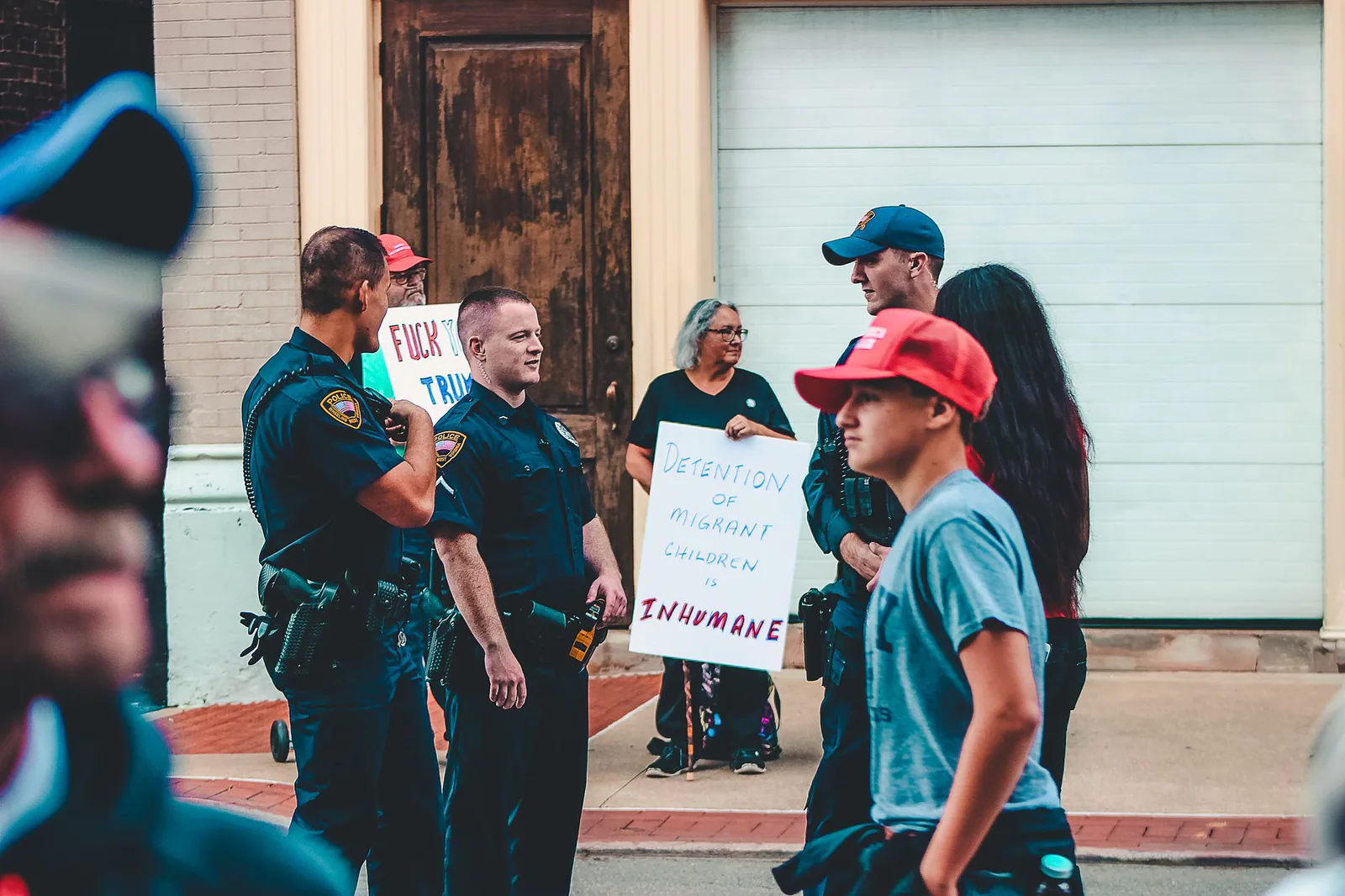 Immigration protest with signs and police presence