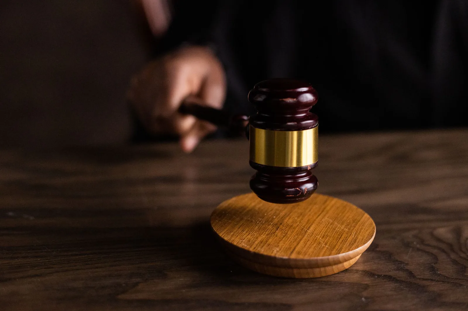 Judge's gavel striking a sound block
